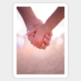 Close up of young female and male hands holding. Sticker